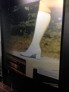 An ad from the 70s showing how small the computer was. A woman's boot...